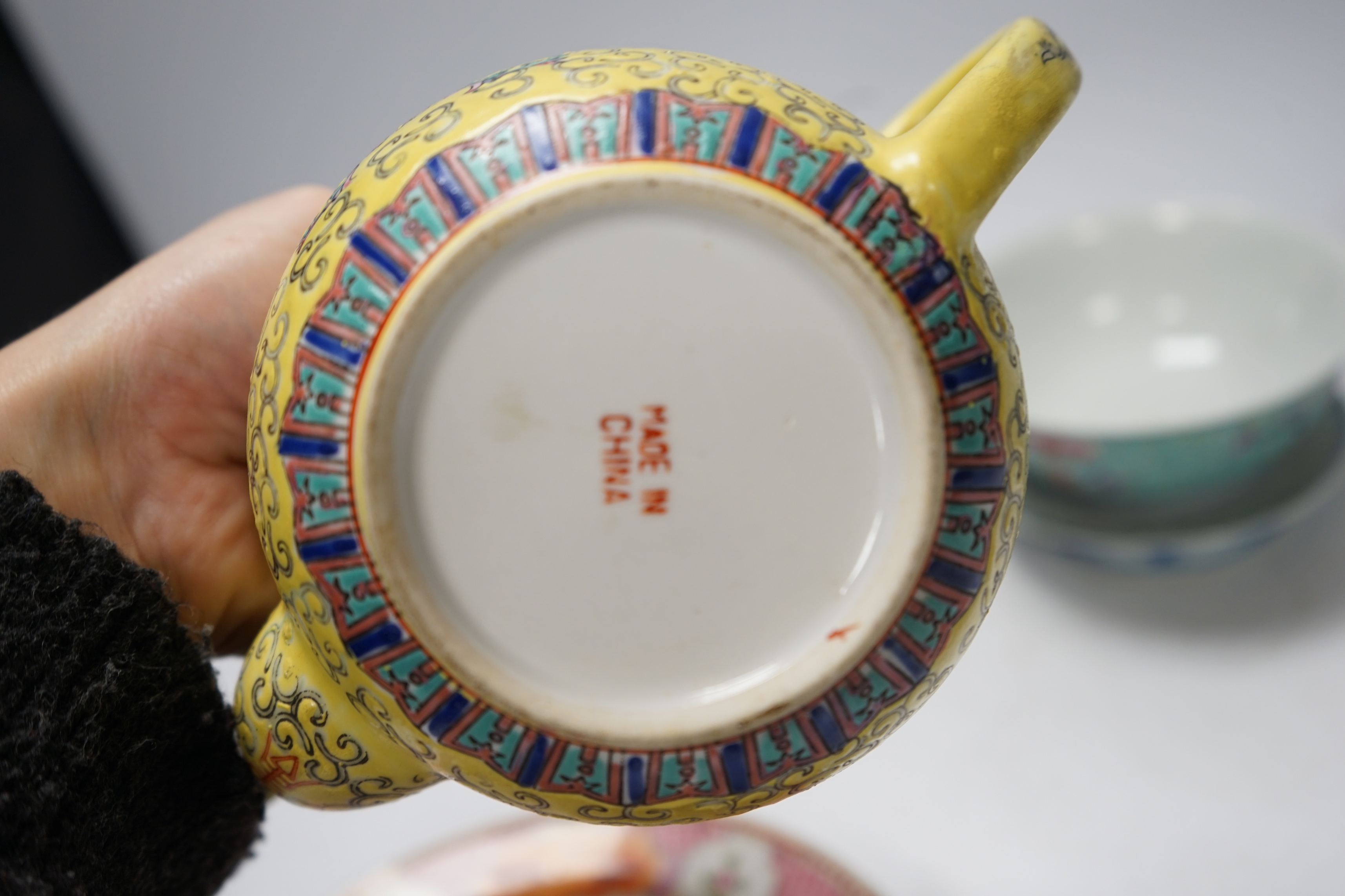 Six Chinese ceramic items; a teapot, two bowls and three small dishes, teapot 10cm